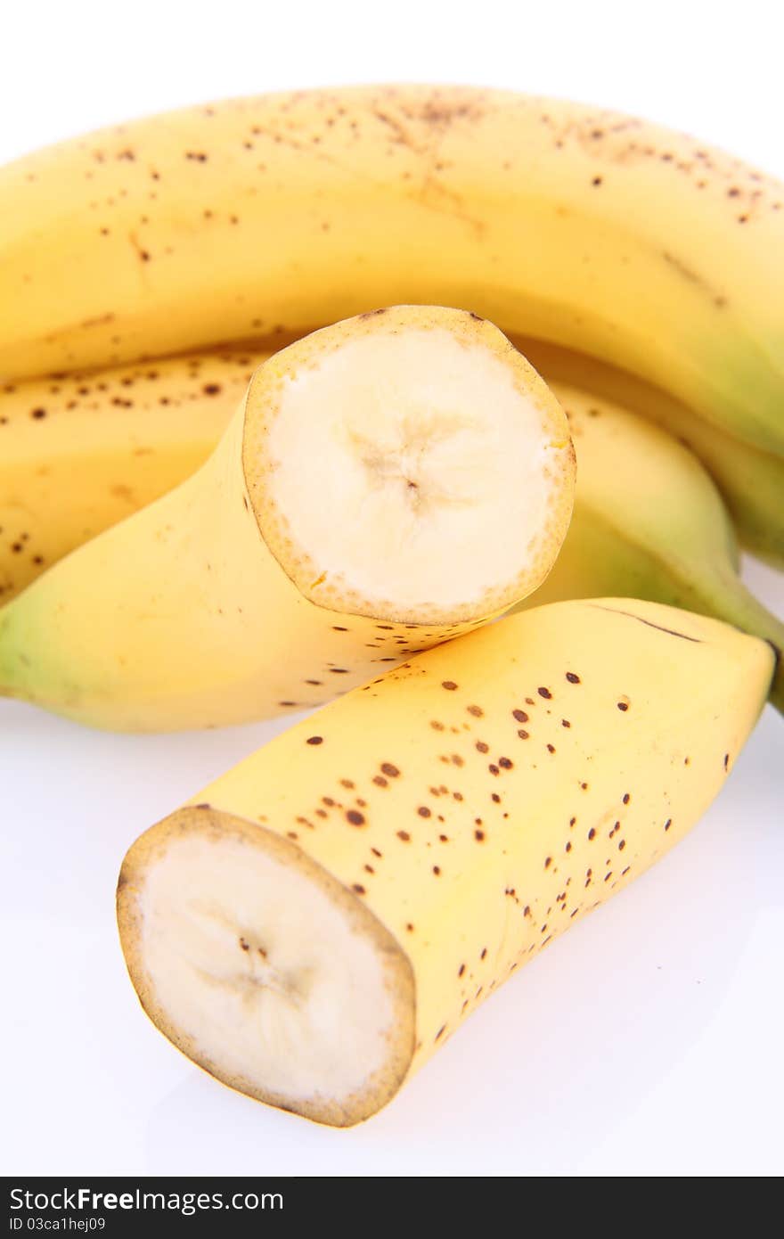 Bananas on white background - one cut in half