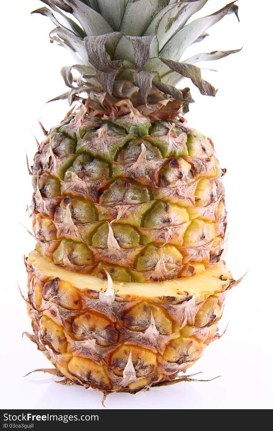 Pineapple - cut in half, in close up on white background