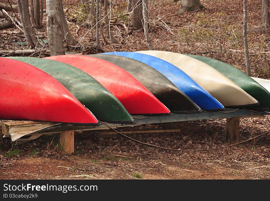 A group of canoes near a lake