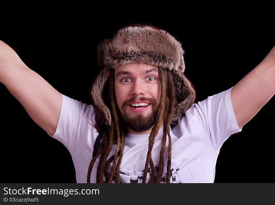 Guy with dreadlocks wearing a fur hat