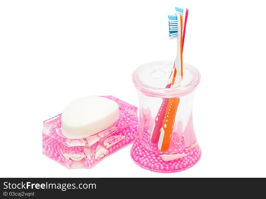 Toothbrushes and soap on a white background