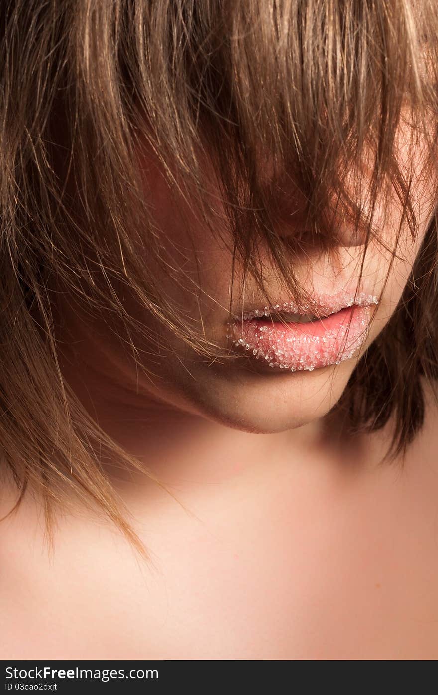 Closeup of a girl with sugar on her lips