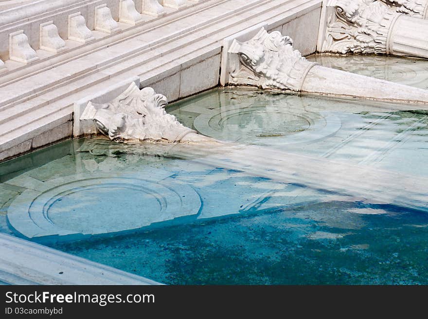 Classic roman monument sunk in water