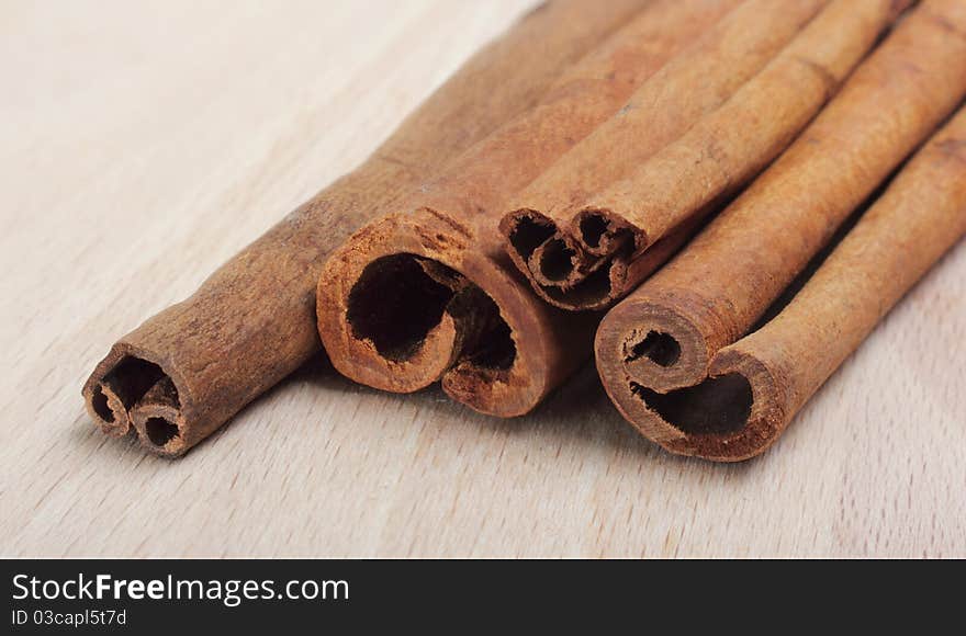 Cinnamon spice Sticks on wooden board close up