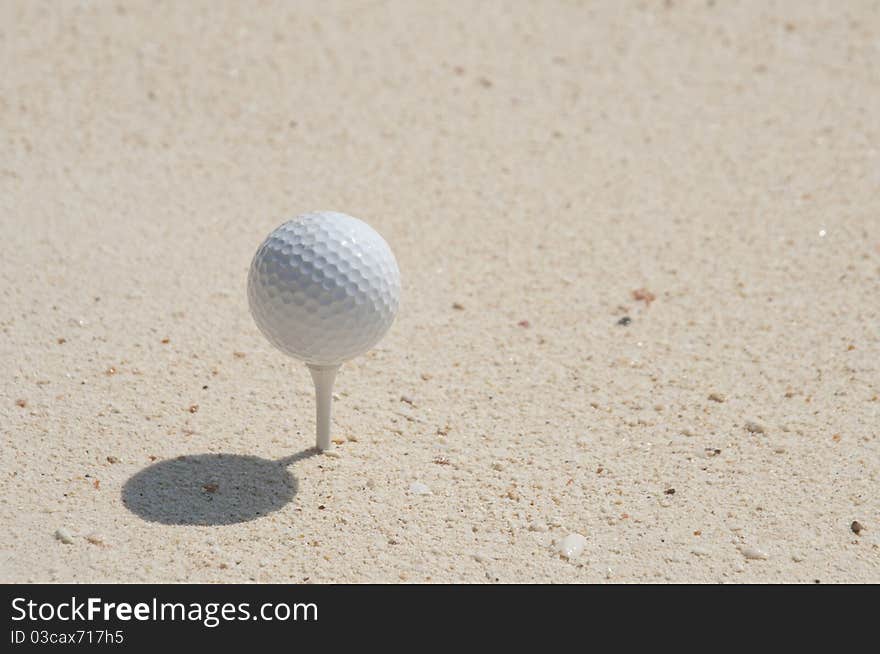 With Golf on the sand.