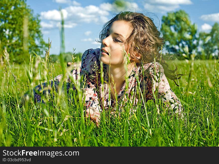 Beautiful girl on the grass