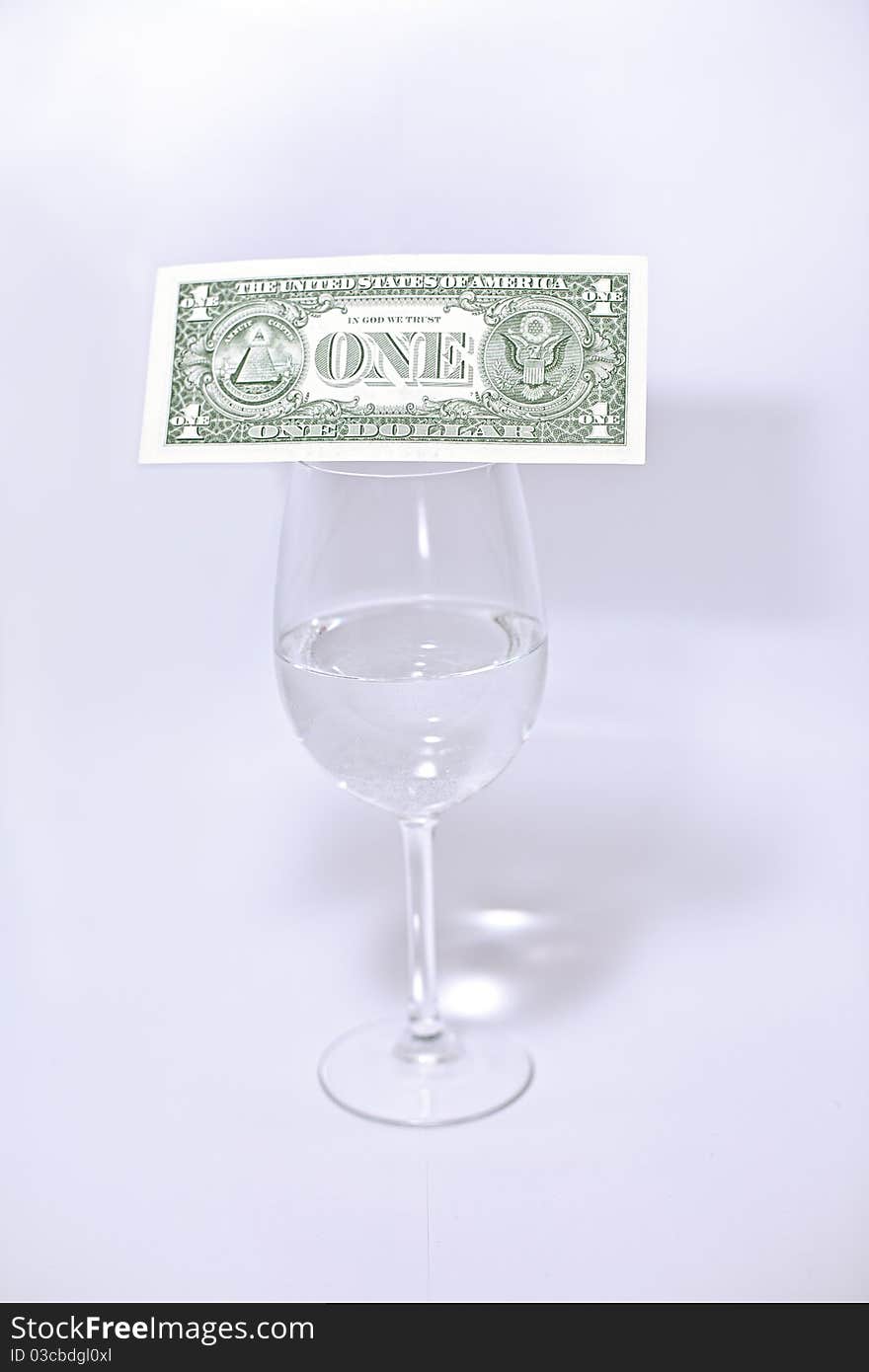 Dollar and wine glass