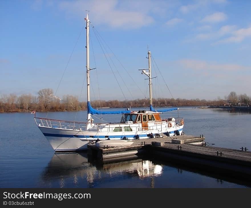 Boat Moored To A Wooden Pier