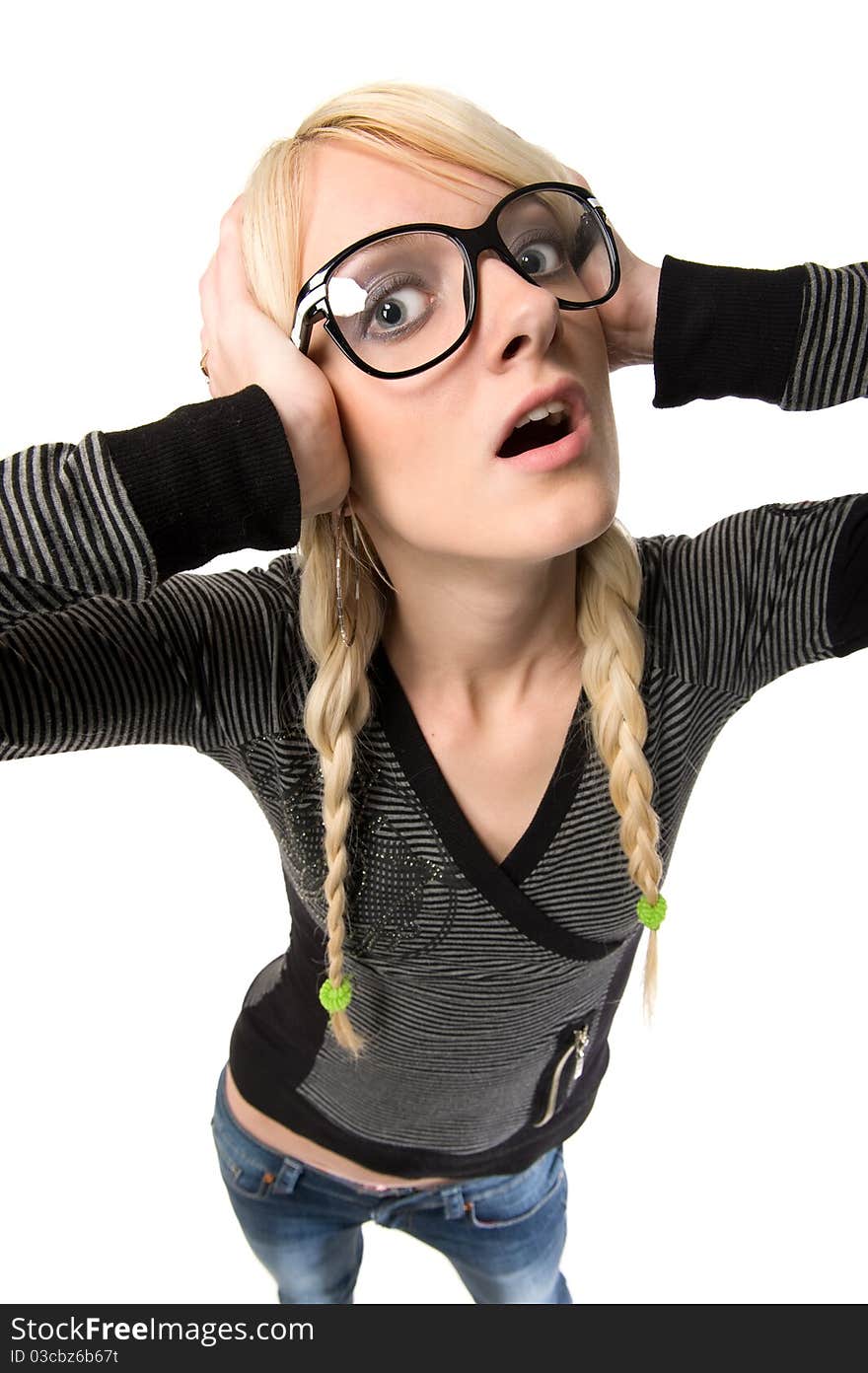 Smart young blond woman with funny glasses and plait looks like nerdy girl. Pose and looking at camera, humor style on white background. Smart young blond woman with funny glasses and plait looks like nerdy girl. Pose and looking at camera, humor style on white background.