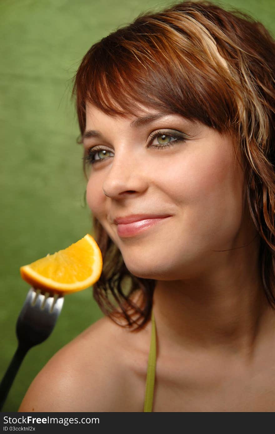 Young girl and orange