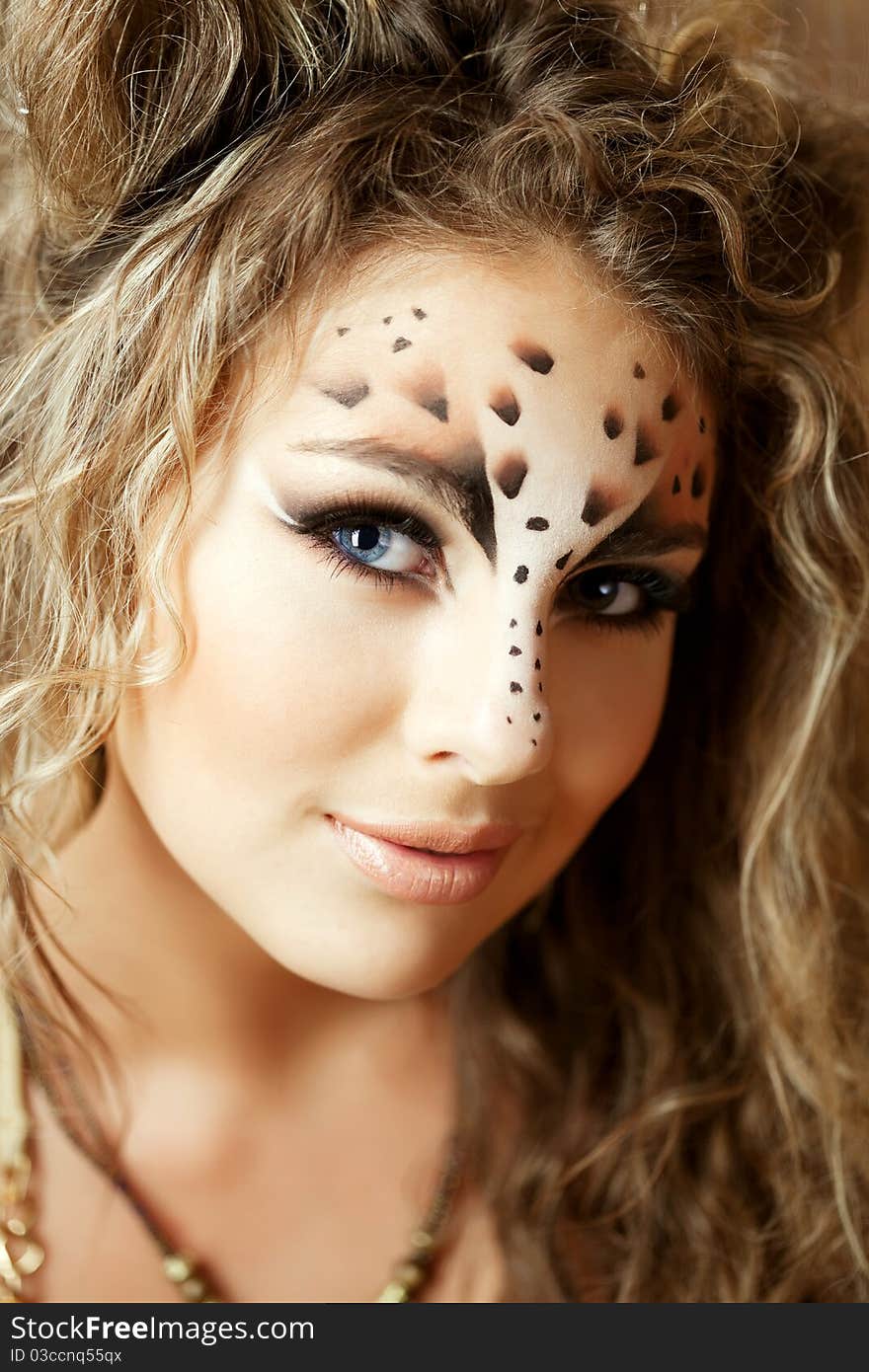 Girl with an unusual make-up as a leopard