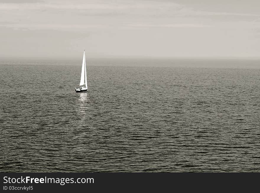 Sailing ship alone on the ocean. Sailing ship alone on the ocean