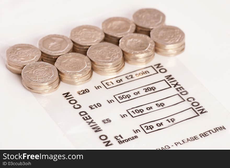 Money bag with sterling twenty pence coins