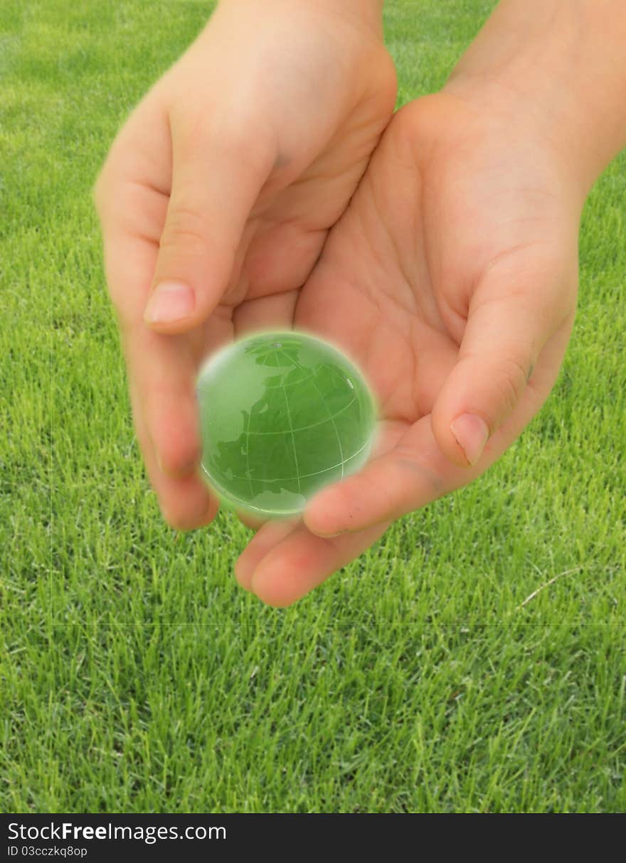 On the green grass, save the planet concept. On the green grass, save the planet concept