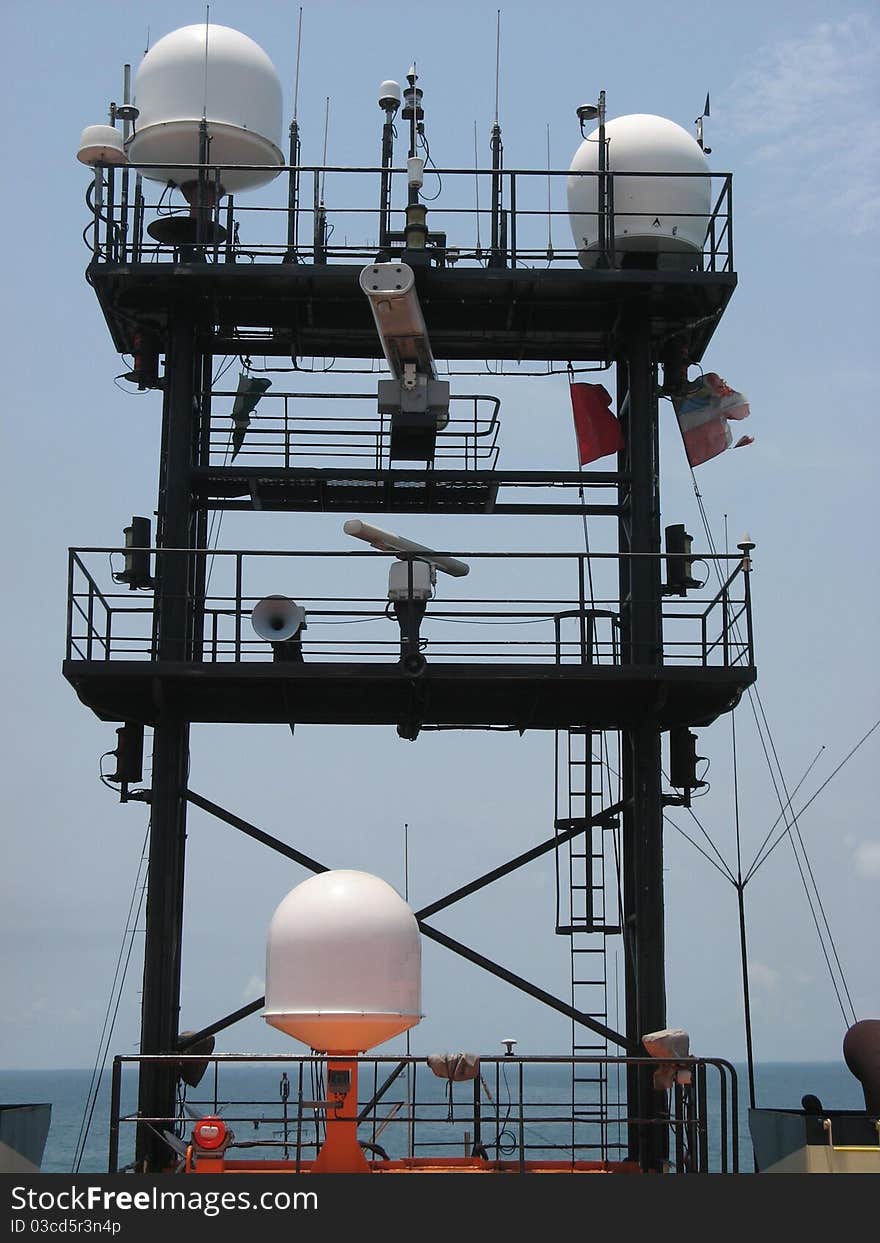 A ship's mast with an array of aerials and domes.