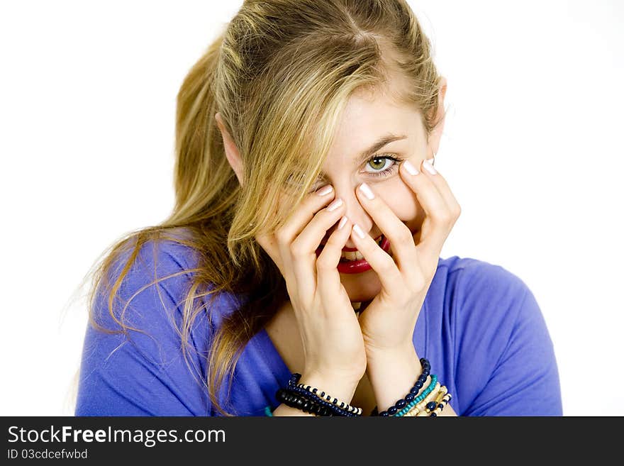 Young blond woman covering her face. Young blond woman covering her face