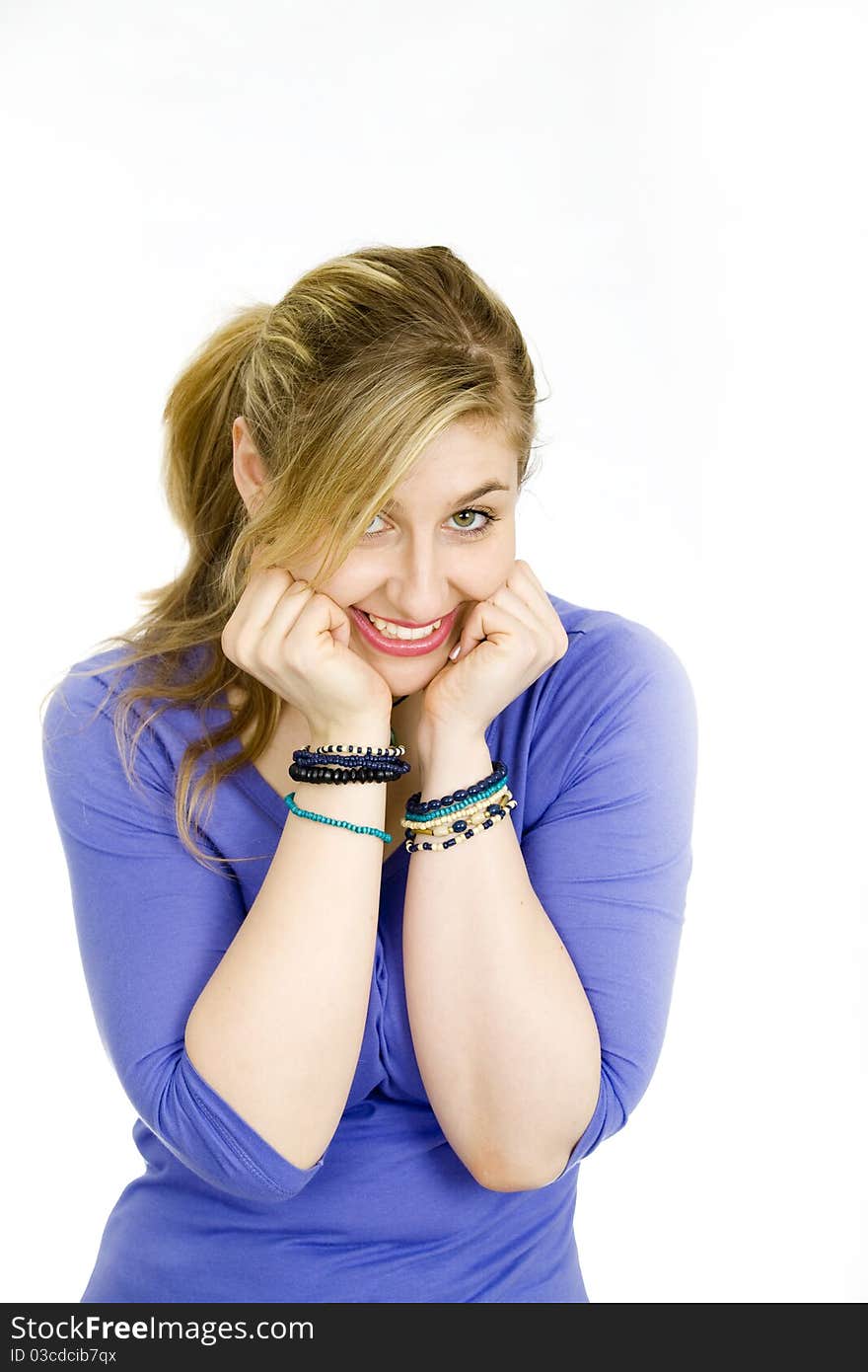 Young blond woman covering her face. Young blond woman covering her face