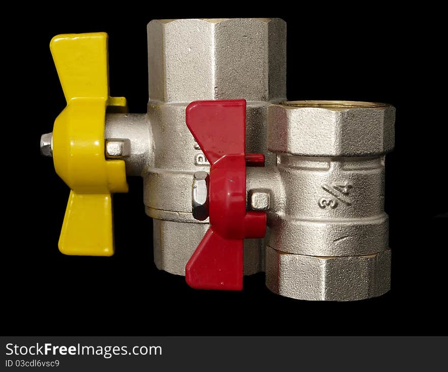 Natural gas and water valves isolated on black background