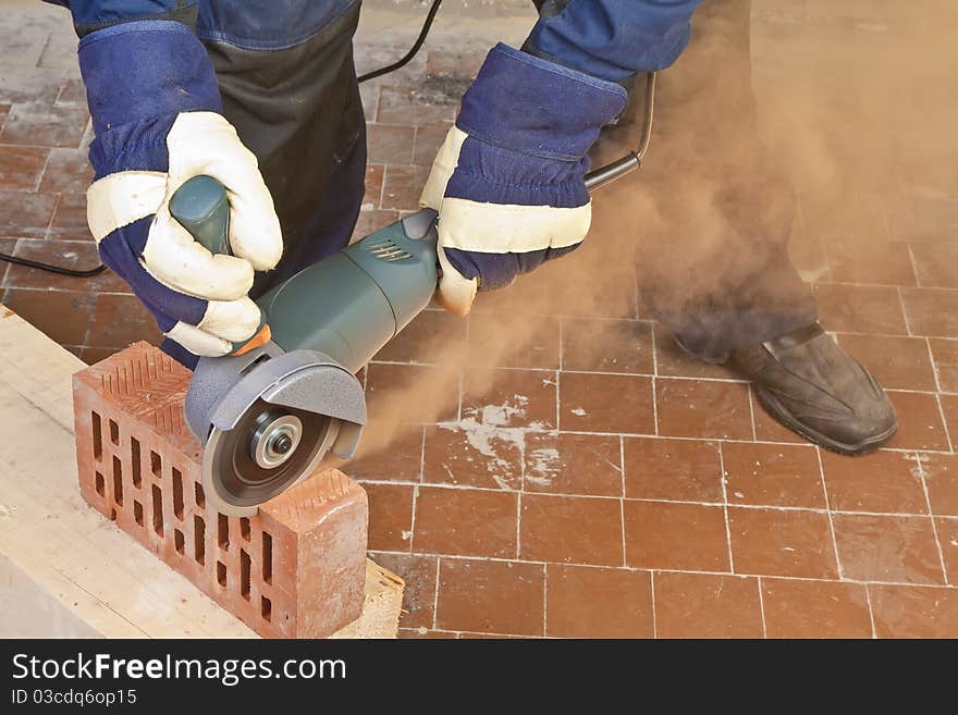 A man working with grinder, close up on tool, hands and sparks, real situation picture. A man working with grinder, close up on tool, hands and sparks, real situation picture