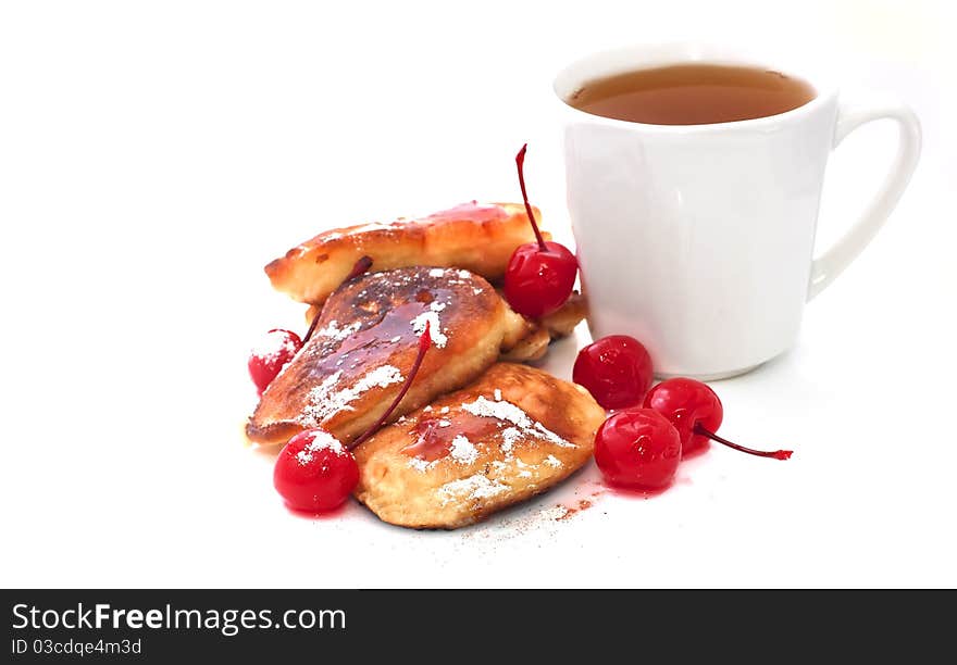 Pancakes with jam and cup of tea