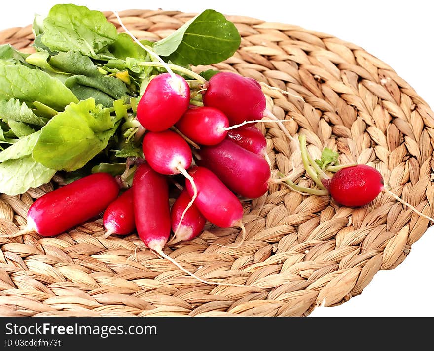 Radish bunch on a wicker napkin