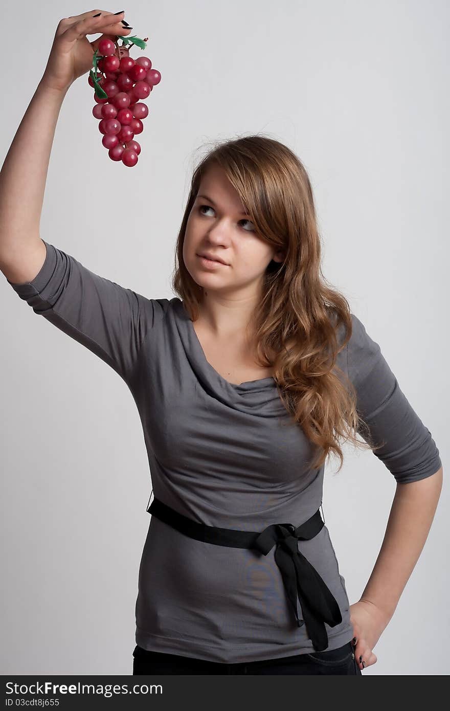 Girl with grapes in his hand