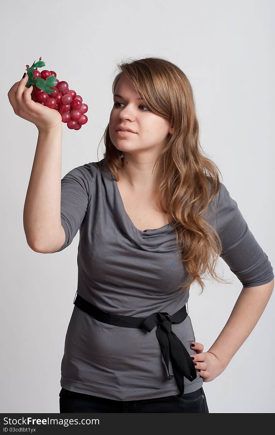 Girl with grapes in his hand