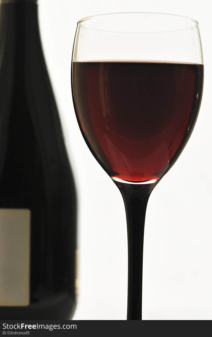 Red wine in glass glasses on the white isolated background