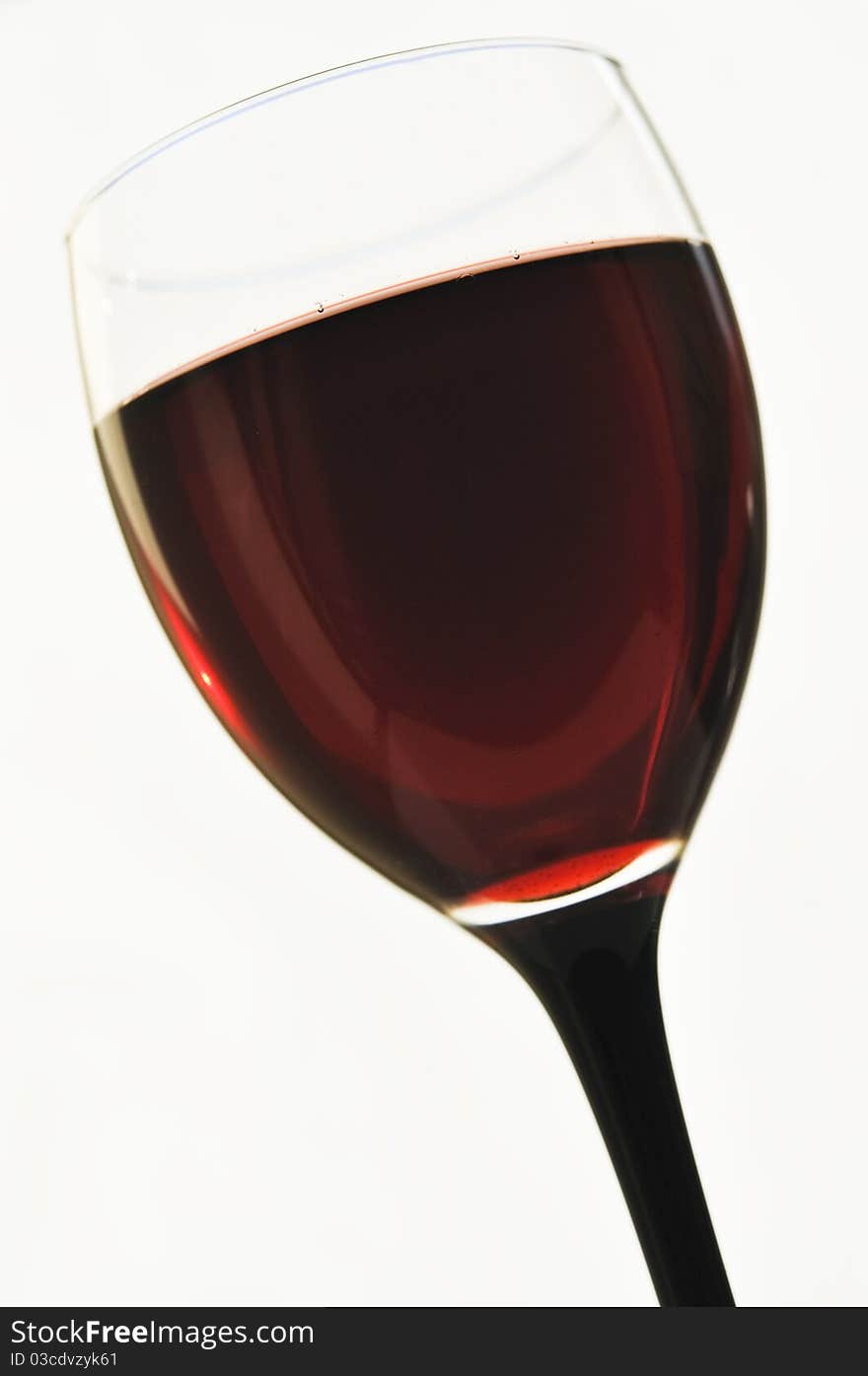 Red wine in glass glasses on the white isolated background