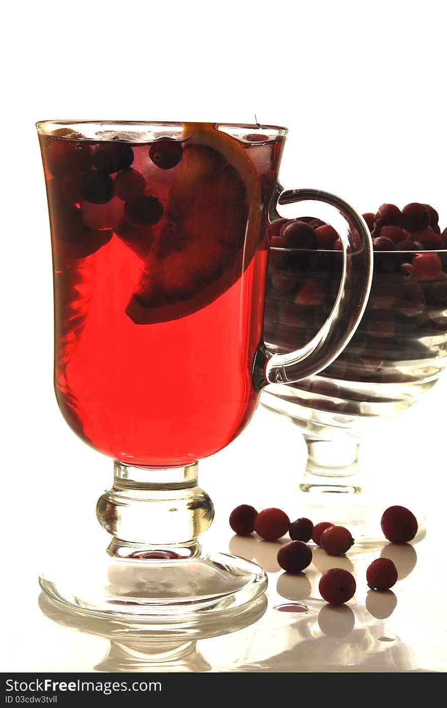 Fruit cocktail in glass glasses on the white isolated background