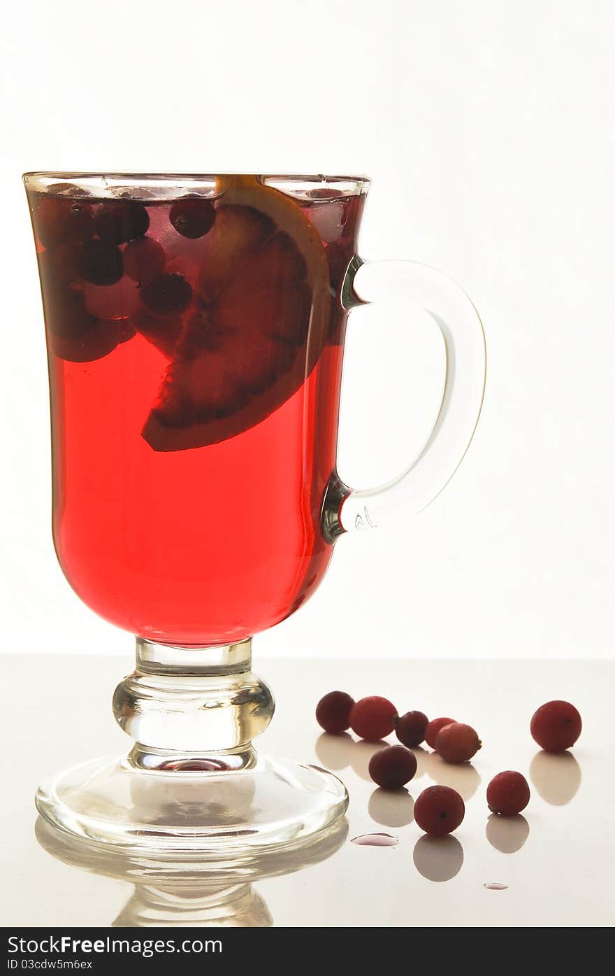 Fruit cocktail in glass glasses on the white isolated background