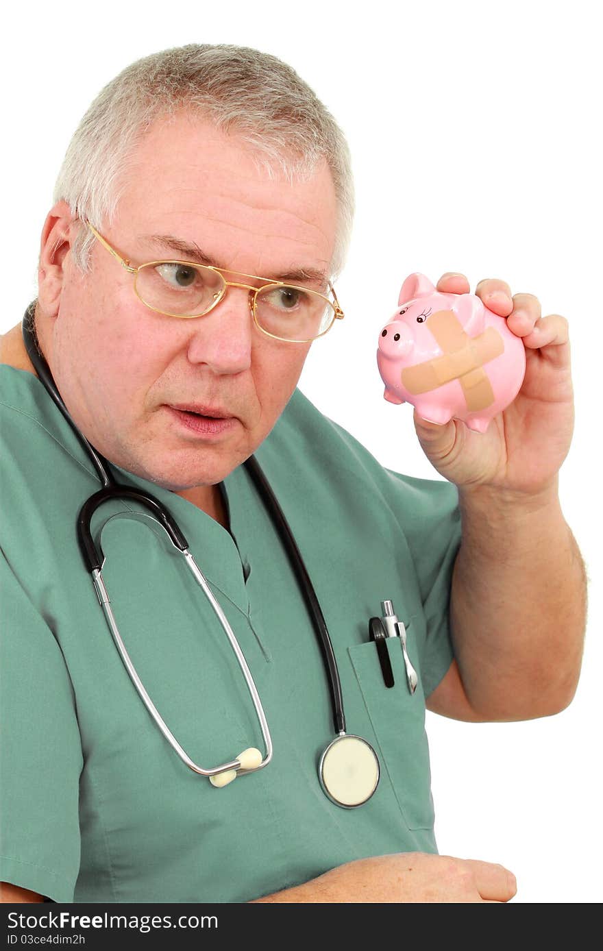 Man in scrubs with a piggy bank