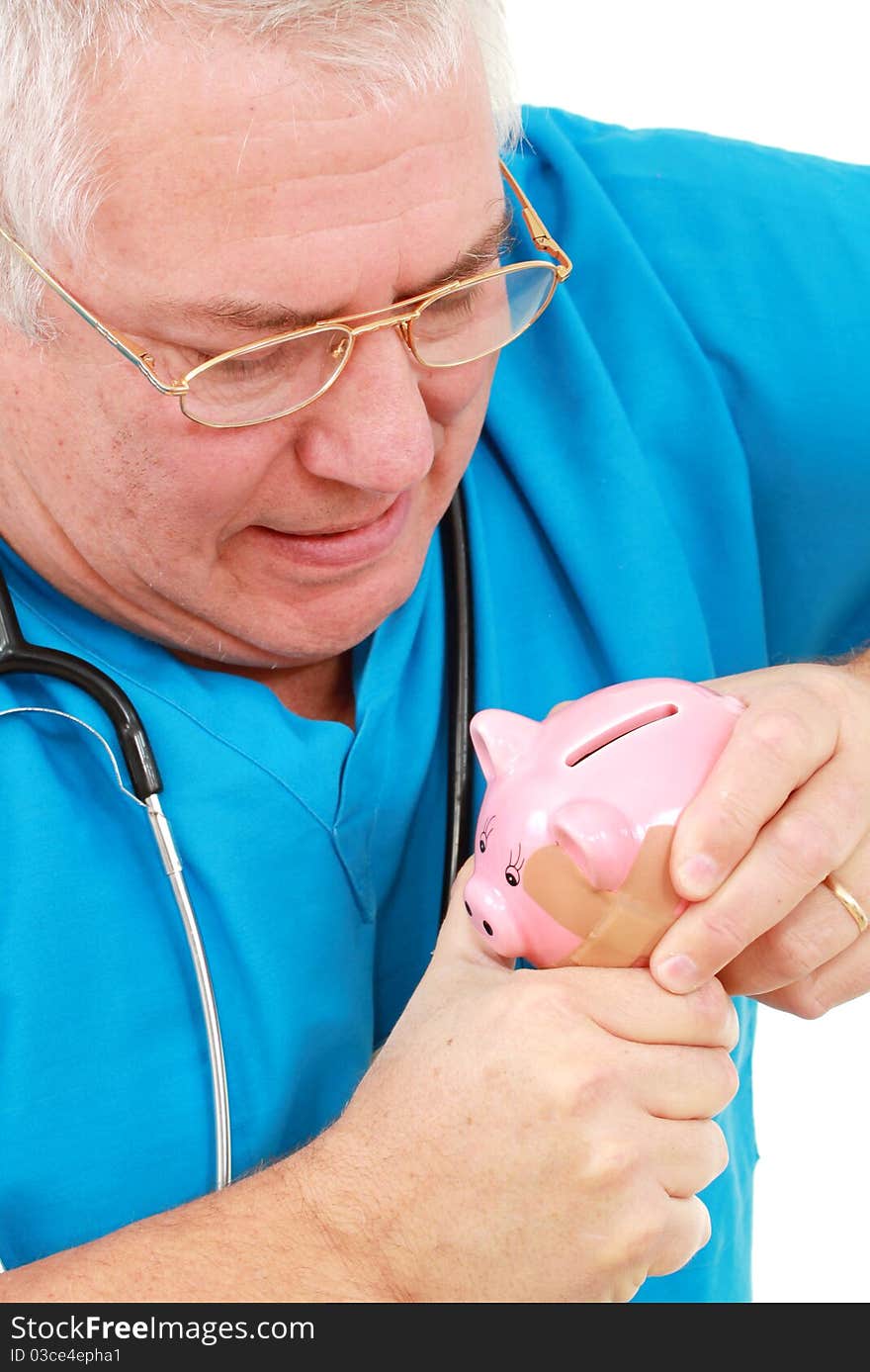 Man in scrubs with a piggy bank