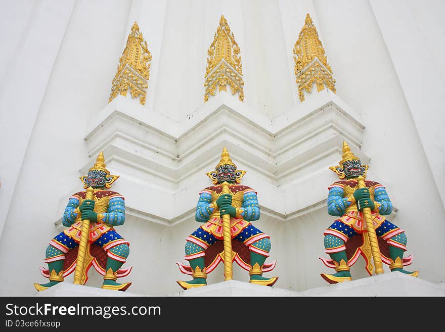 Giant Guardians On Base Of Pagoda, Thailand