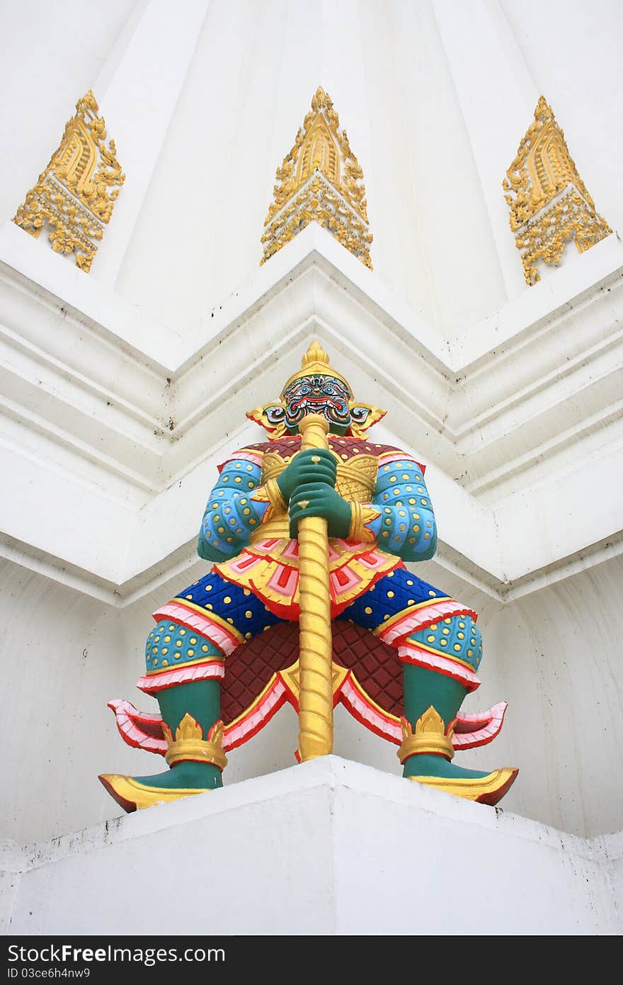 Giant guardians on base of pagoda, Thailand