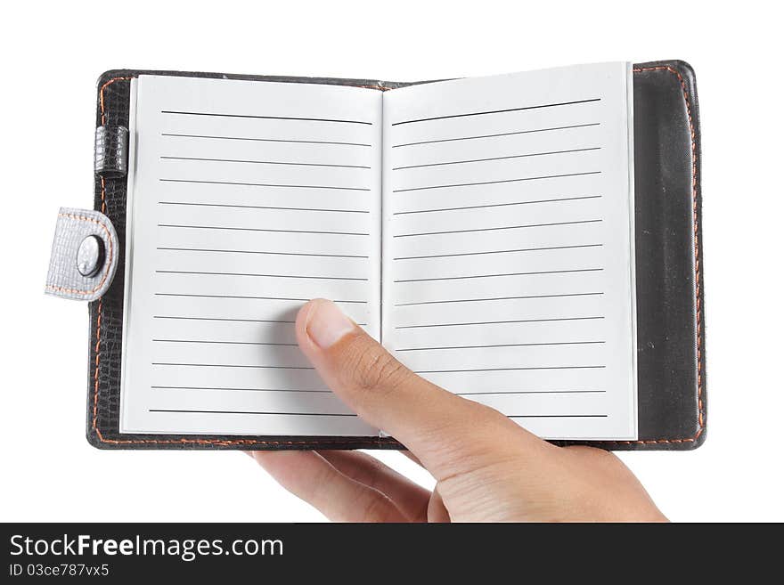 Hand holding a notebook on a white background