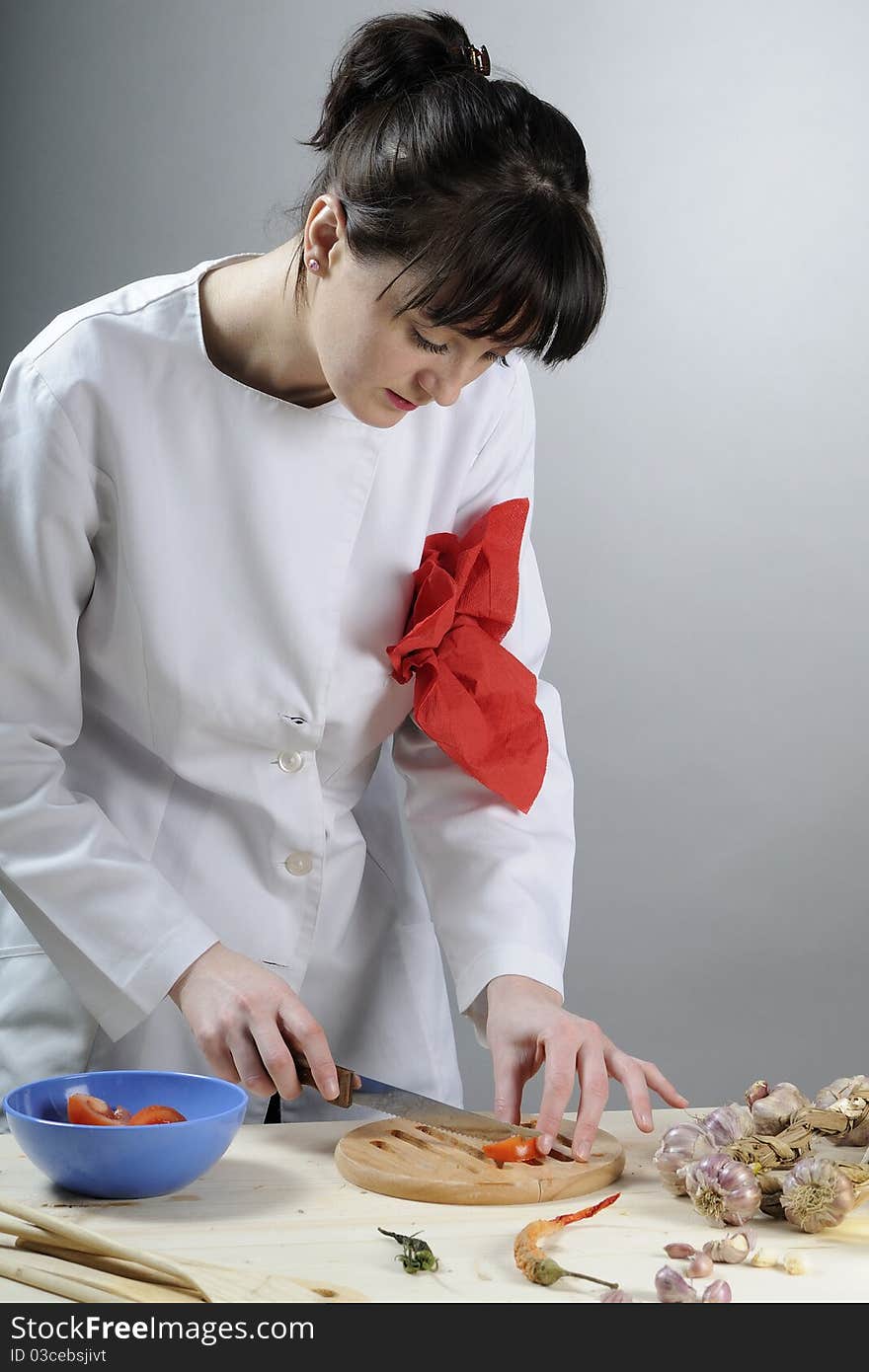 Young chef preparing healthy food in kitchen. Young chef preparing healthy food in kitchen