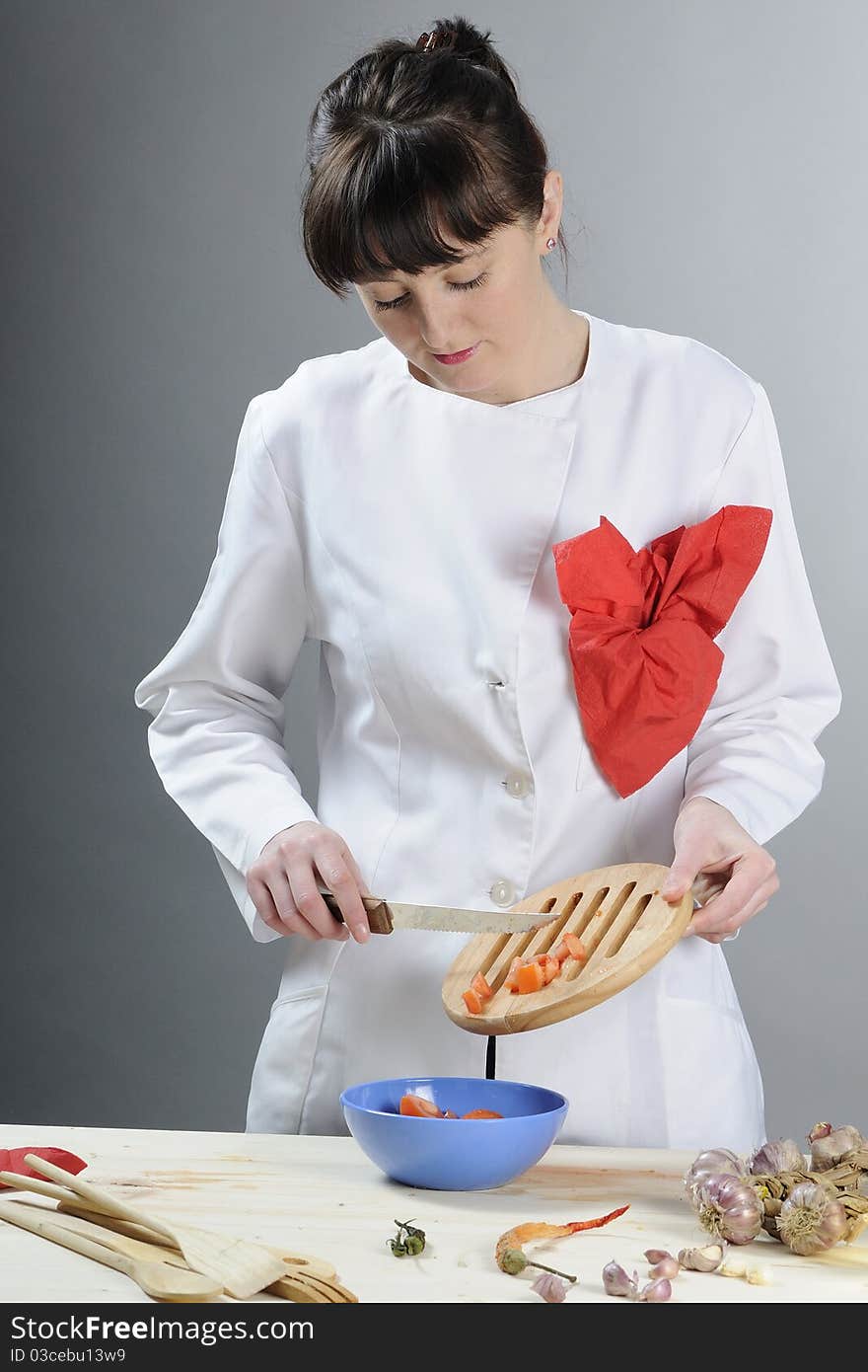 Young chef preparing healthy food in kitchen. Young chef preparing healthy food in kitchen