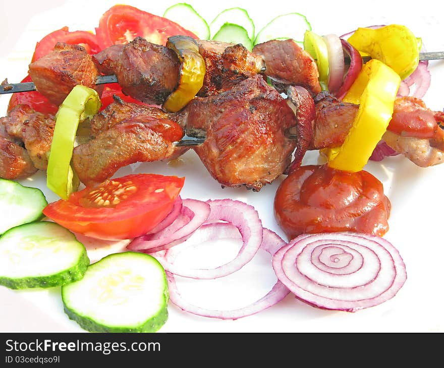 Grilled barbecue meat with vegetables