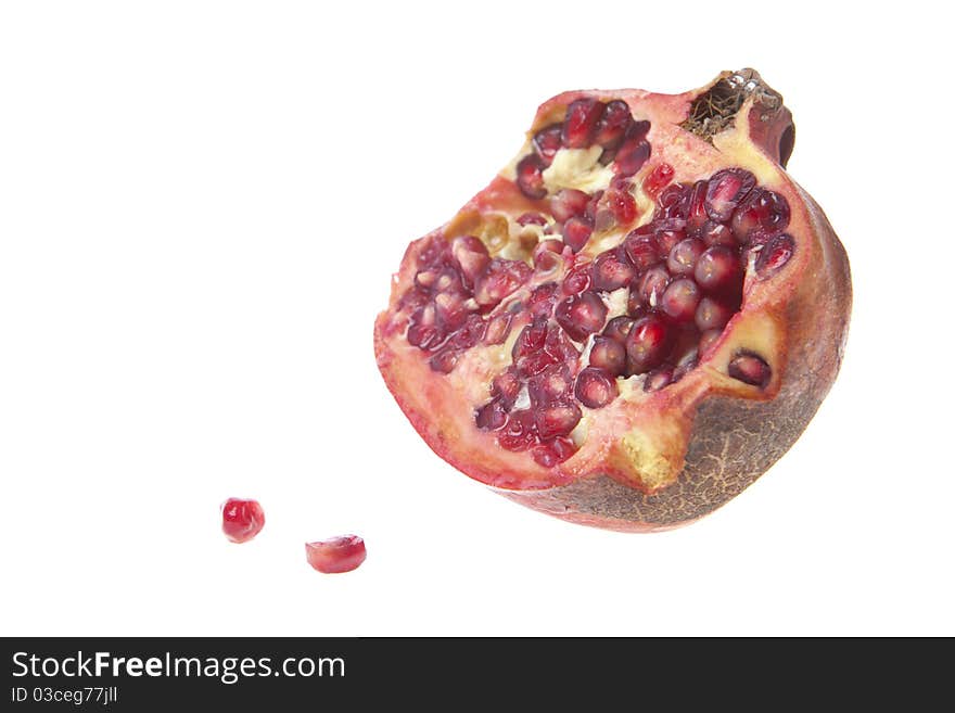 Colorful pomegranates isolated on white Picture shot in Studio.