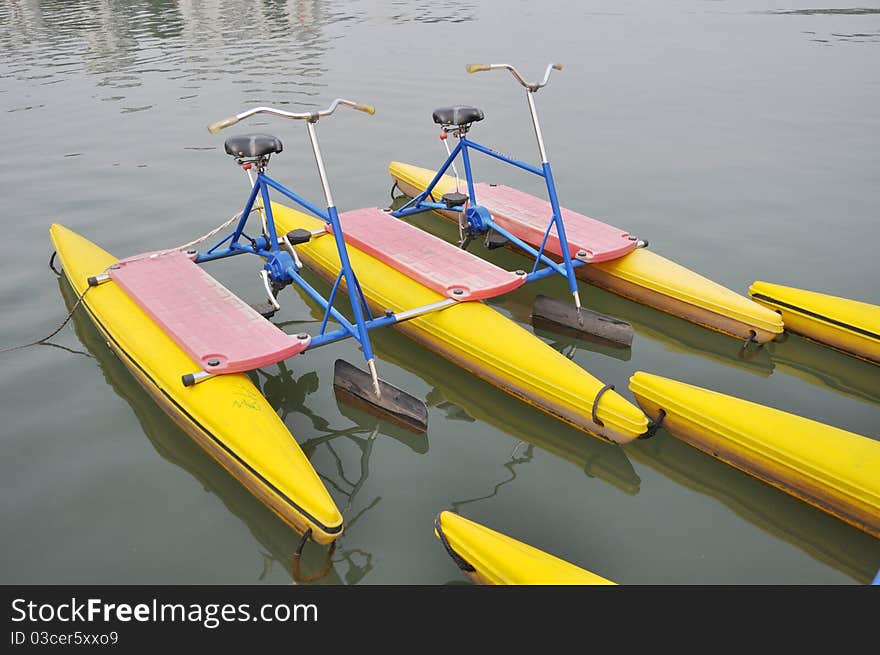 A watercycle on the berth by the lakeside. A watercycle on the berth by the lakeside.