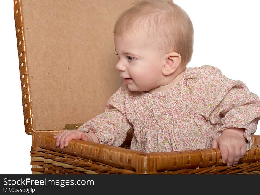 Closeup portrait of little cute baby girl in basket. Isolated on white. Closeup portrait of little cute baby girl in basket. Isolated on white