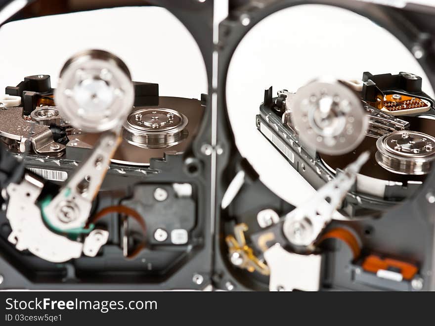 Opened hard disks on white background. Studio shot