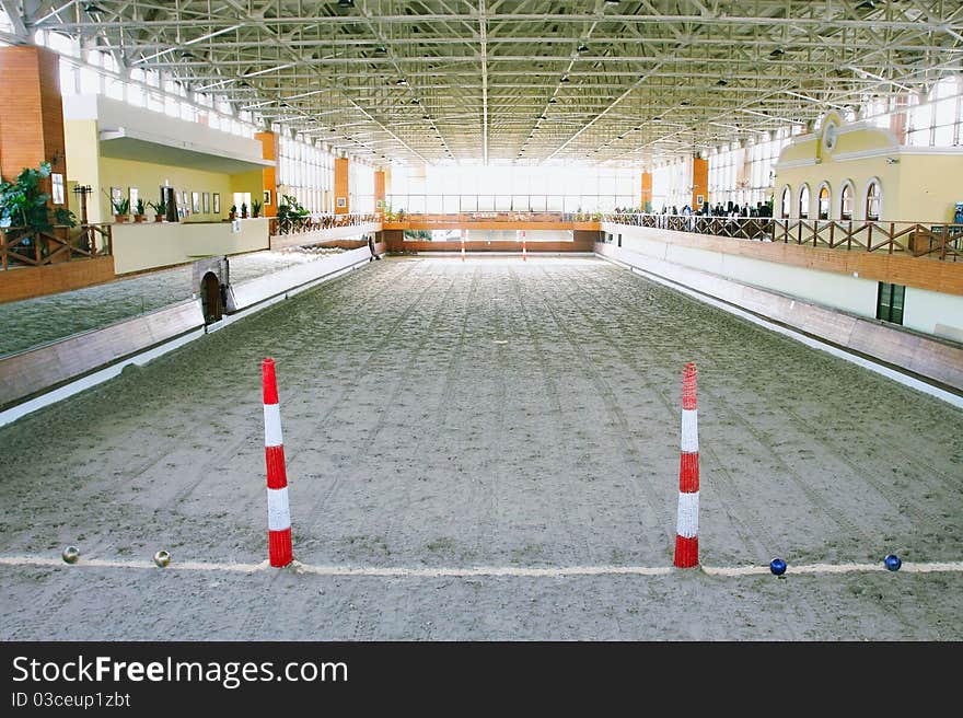 The image of a hall with polo field