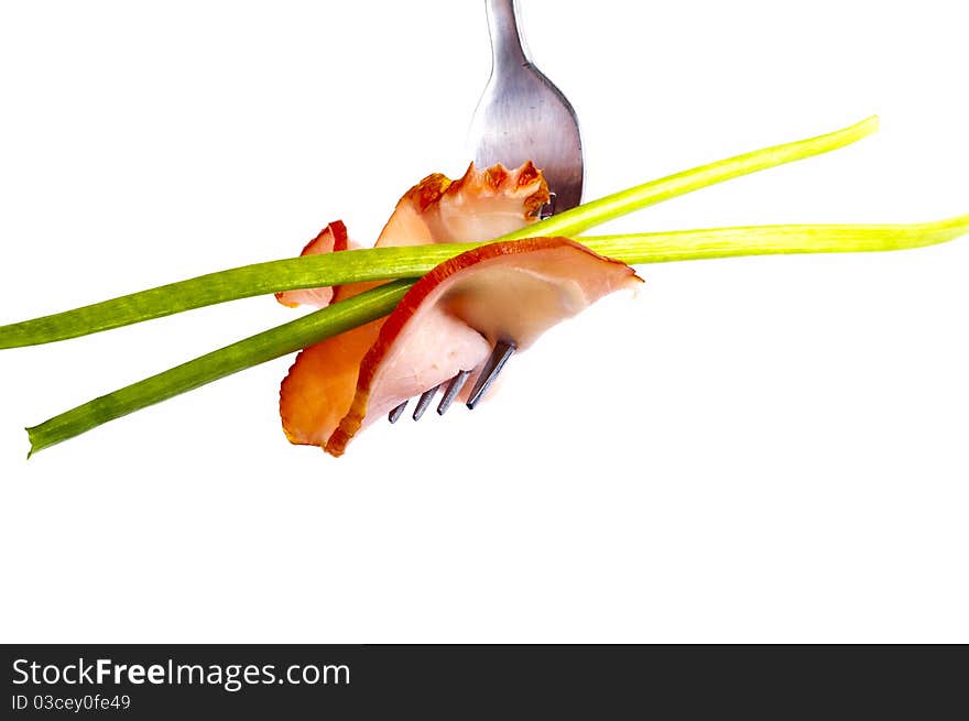 Delicious sausage on a fork on white background