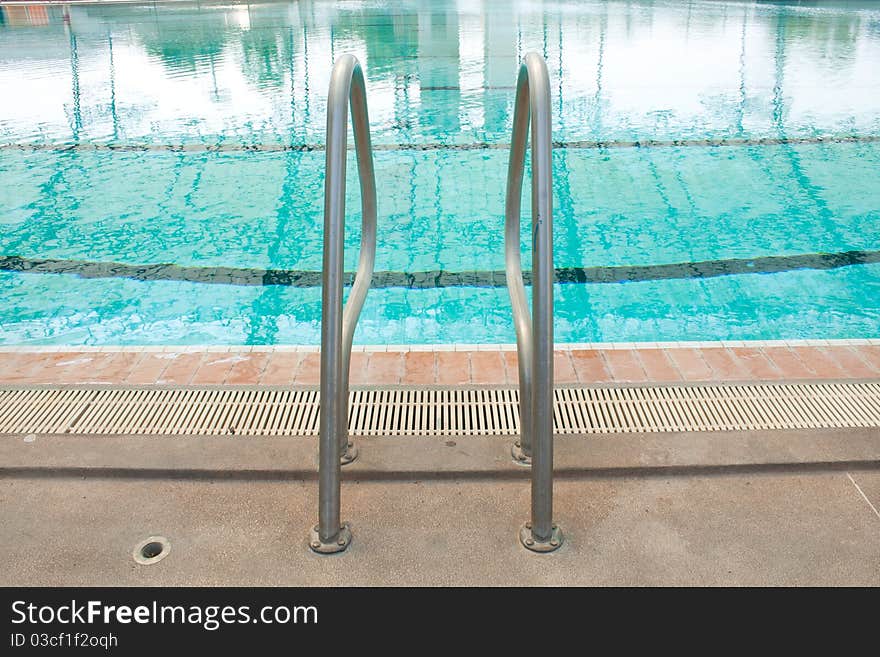 Some steel into the pool. Next to the pool water.