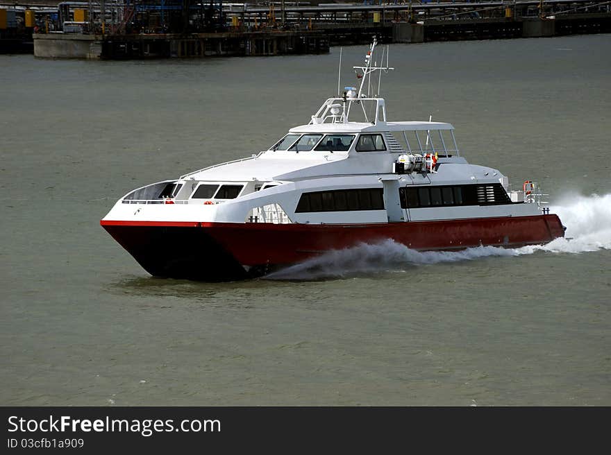 A fast catamaran passenger ferry underway. A fast catamaran passenger ferry underway