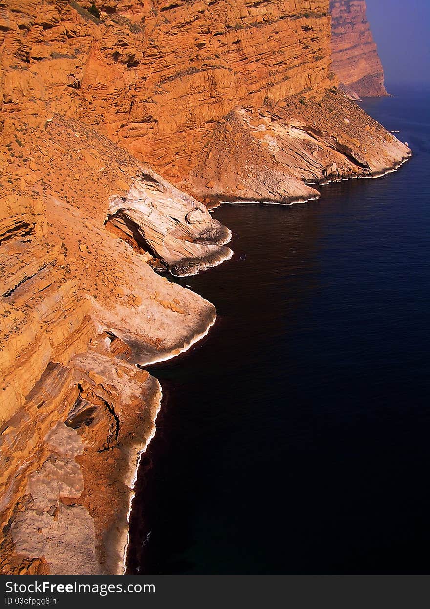 Majestic orange mount and dark sea. Majestic orange mount and dark sea