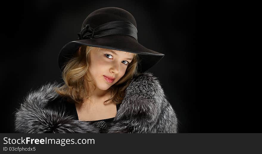 Portrait beautiful young lady in grey fur and hat