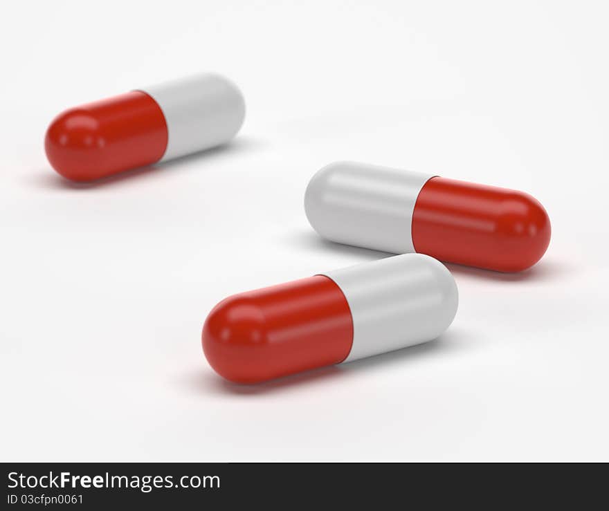 Three capsules on white background